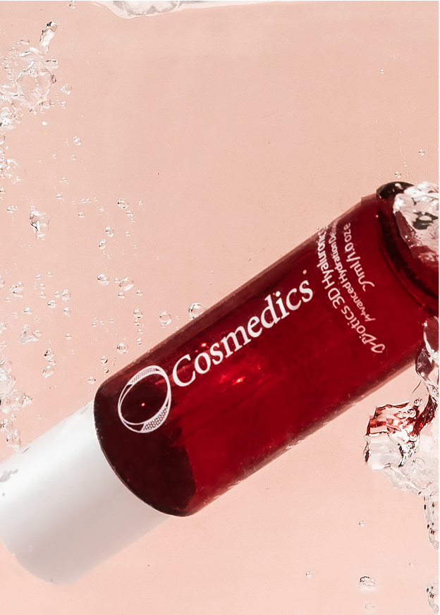 O Cosmedics 3D Hyaluronic Serum submerged in water to represent hydration. Hyaluronic Acid helps the skin increase its capacity to hold onto water. 